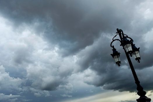 Street lamp and cloudy sky in the city of Bordeaux, France