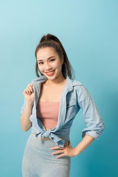 Active young woman in casual summer outfit having fun indoor.