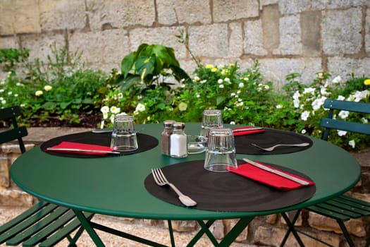 Table set up on the terrace of a French bistro