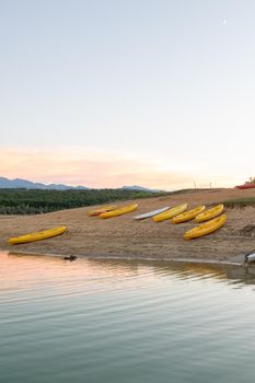 Sunset on Lake Montbel in Ariege with the boats in the summer of 2022.