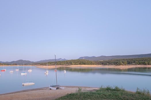 Montbel, France. 2022 August 2 . Sunset on Lake Montbel in Ariege with the boats in the summer of 2022.