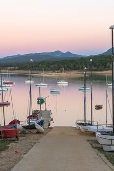 Montbel, France. 2022 August 2 . Sunset on Lake Montbel in Ariege with the boats in the summer of 2022.