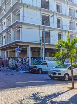 Playa del Carmen Mexico 04. July 2022 Typical street road and cityscape with cars and buildings of Luis Donaldo Colosio Playa del Carmen in Mexico.