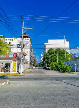 Playa del Carmen Mexico 04. July 2022 Typical street road and cityscape with cars and buildings of Luis Donaldo Colosio Playa del Carmen in Mexico.