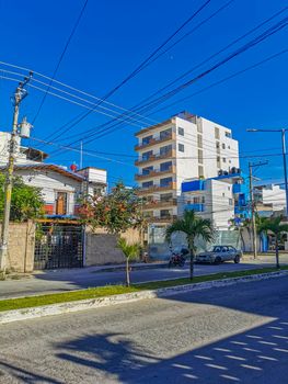 Playa del Carmen Mexico 04. July 2022 Typical street road and cityscape with cars and buildings of Luis Donaldo Colosio Playa del Carmen in Mexico.