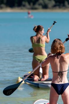 Montbel, France. 2022 August 2 . People practicing water sports on Lake Montbel in Ariege with the boats in the summer of 2022.