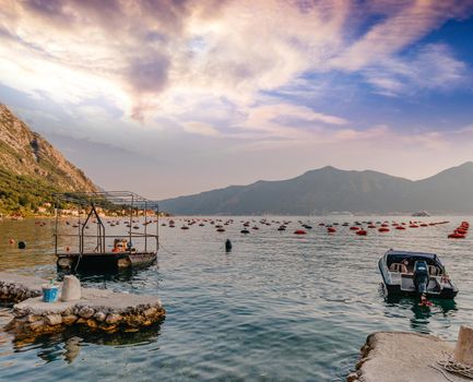 Fishing boat on an oyster farm in the Bay of Kotor, Montenegro. High quality photo.