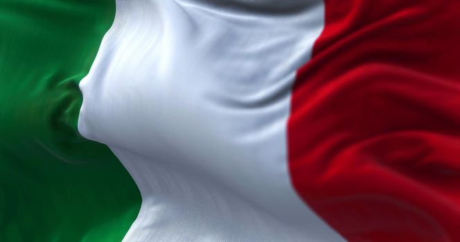 Close-up view of the italian national flag waving in the wind. Italy is a country located in the middle of the Mediterranean Sea, in Southern Europe. Fabric textured background. Selective focus