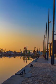 Bremerhaven Germany 12. March 2011 Sunset and cityscape and coast panorama of ATLANTIC Hotel Sail City lighthouse architecture ships yachts boats dike and landscape of Bremerhaven in Germany.