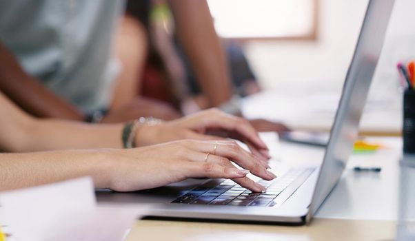 The best design resources are a click away. an unrecognisable businessman and businesswoman using a laptop in a modern office