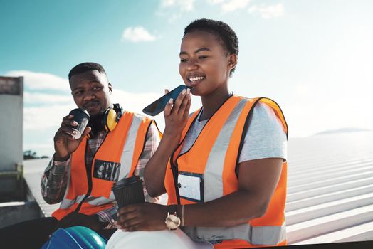 Rest is part of the productivity package. a young woman using a smartphone on a coffee break at a construction site