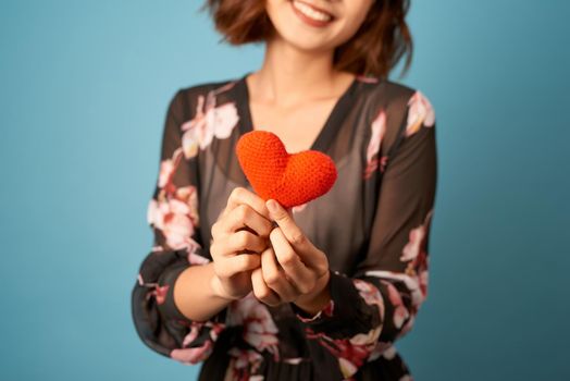 Valentines day woman holding a heart in front of her