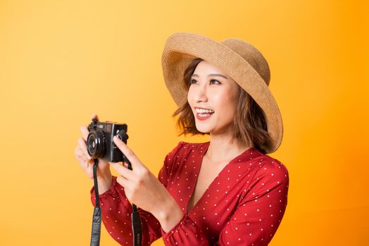 Happy travel woman take a picture by black camera, Asian beauty