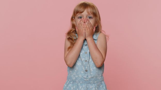 Oh my God, Wow. Young preteen child girl kid looking surprised at camera with big eyes, shocked by sudden victory, game winning lottery goal achievemen good news. Toddler children on pink background