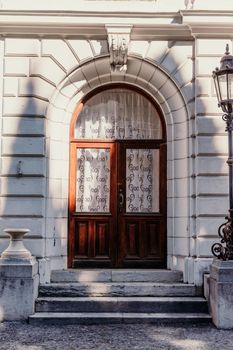 Wood Carved door. A beautiful old wooden door. Old doors, fragments of old doors, texture of old wooden doors.