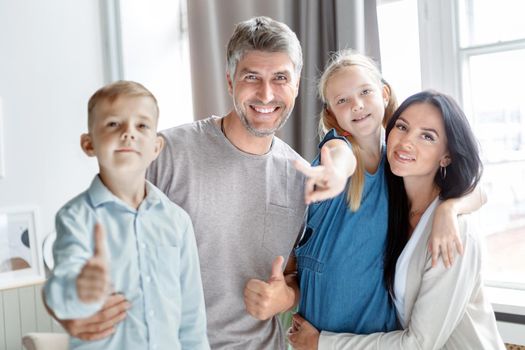 portrait of a happy family near the window. close-up.