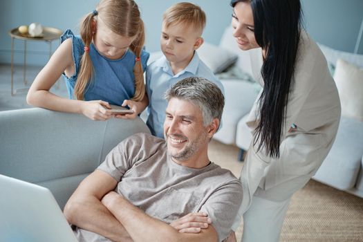 family with children communicate in the living room. concept of family pastime.