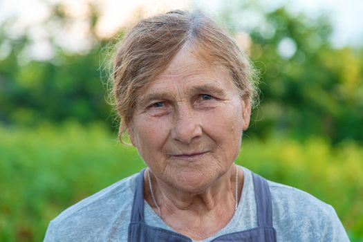 Portrait of a grandmother in the garden. selective focus. People.