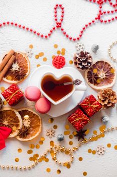 New Year 's tea on a white background . Glitter and white background. Holiday. Holiday decorations. Hot tea . The layout is a festive tea party. Christmas