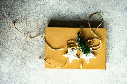 Christmas holiday gift box wrapping concept on concrete background