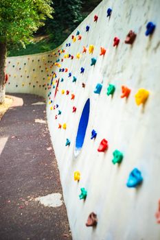 Summer kids activity playground with climbing wall