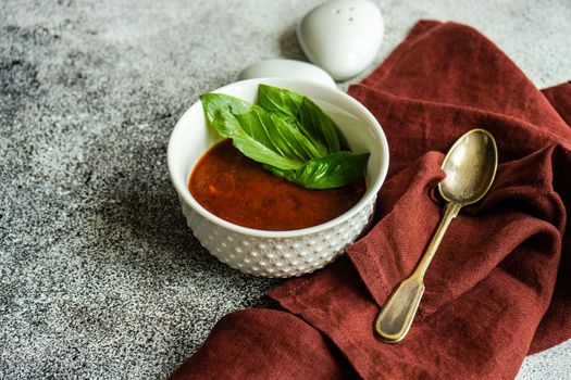 Served spanish gazpacho soup on rustic background with copy space