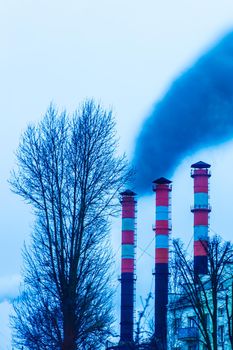 Pollution of the environment, air and ecology are global problems. Toxic smoke from the dirty chimney of an industrial plant is released into the atmosphere.