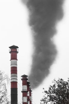 Pollution of the environment, air and ecology are global problems. Toxic smoke from the dirty chimney of an industrial plant is released into the atmosphere.