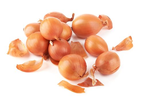 Ripe fresh golden onions on a white background