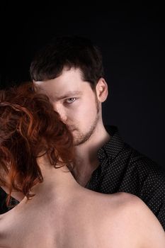 Man and red woman - closeup lovers portrait