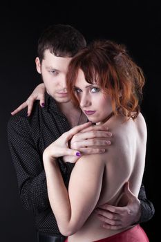 red naked woman and serious man - romantic portrait