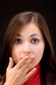 Young woman with fear face close her mouth