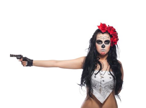 woman wearing with roses dressed up for All Souls Day with gun isolated