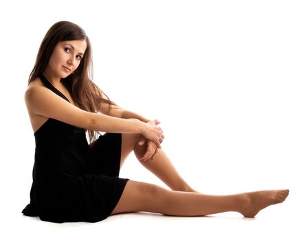 young dancer sit on white background isolated