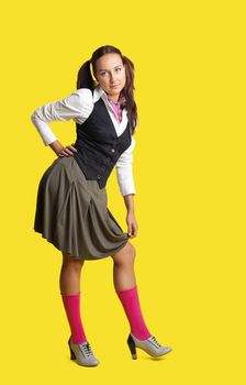 Young woman posing in artist retro style cloth like school girl