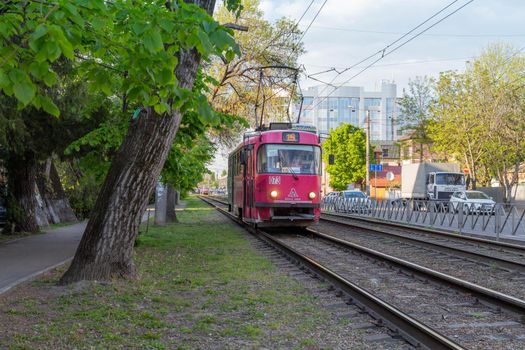 Russia. Krasnodar on April 24, 2020. Red tram. Public transport.