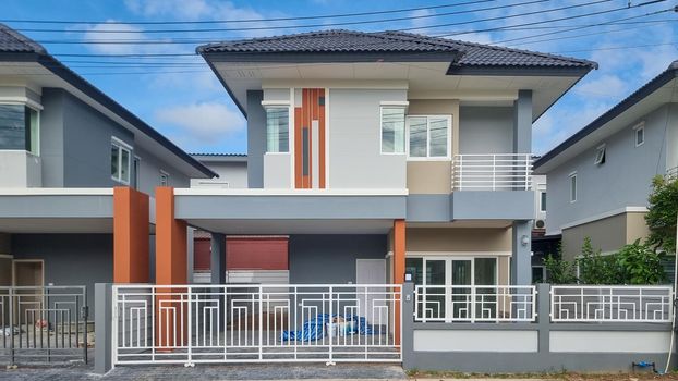 Thai Suburban areas with modern family houses, newly built modern family homes in Thailand, Thai family houses, and apartment houses, newly build streets with modern houses.