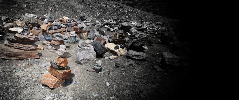 Stack of stones on top of the mountain. Pile of rocks stone and mountains. Balanced stone pyramid or Stacked stone or mountain stones tower. Stones arranged for meditation. Represent spirit of Zen.