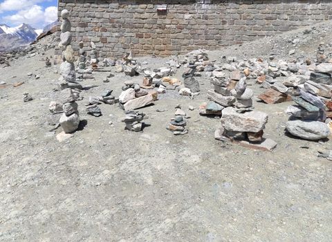 Stack of stones on top of the mountain. Pile of rocks stone and mountains. Balanced stone pyramid or Stacked stone or mountain stones tower. Stones arranged for meditation. Represent spirit of Zen.