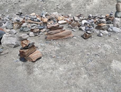 Stack of stones on top of the mountain. Pile of rocks stone and mountains. Balanced stone pyramid or Stacked stone or mountain stones tower. Stones arranged for meditation. Represent spirit of Zen.