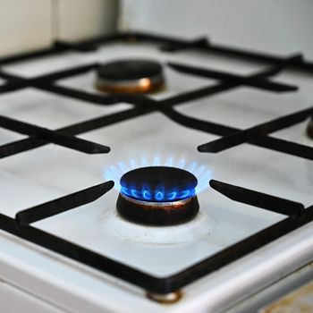 Gas stove for cooking in the kitchen. Gas crisis in Europe - high energy prices and stoppage of gas supplies. Russian war in Ukraine.