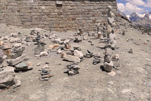 Stack of stones on top of the mountain. Pile of rocks stone and mountains. Balanced stone pyramid or Stacked stone or mountain stones tower. Stones arranged for meditation. Represent spirit of Zen.