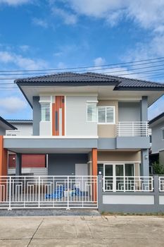 Thai Suburban areas with modern family houses, newly built modern family homes in Thailand, Thai family houses, and apartment houses, newly build streets with modern houses.
