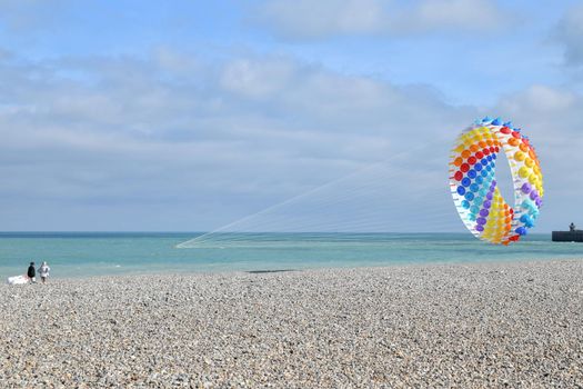 Multicolored air kite at the Atlantic ocean