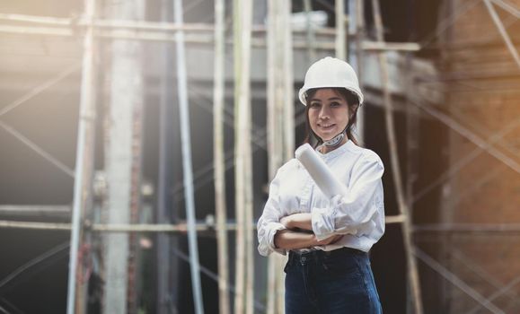Female construction engineer. Portrait of a young woman working at a construction site..