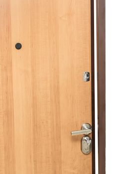 Wooden door entrance, with iron handle, key lock hole and peephole.