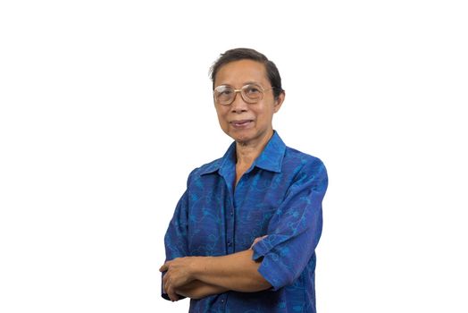 Asian elderly woman standing with her arms crossed on background.