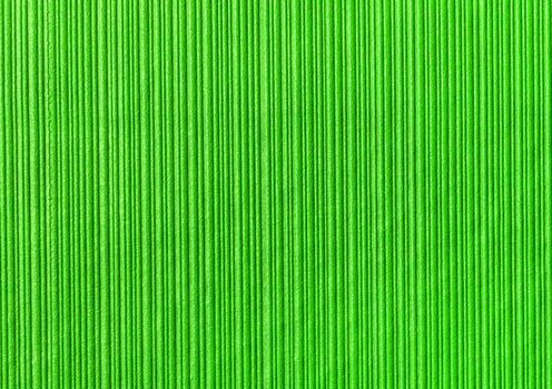 Green abstract striped pattern wallpaper background, paper texture with vertical lines.