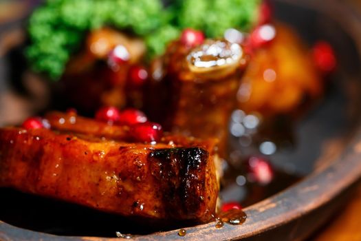 Baked ribs with pomegranate sauce. Original dish from the chef