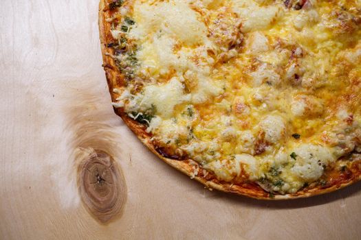 Home cooked pizza on a wooden board